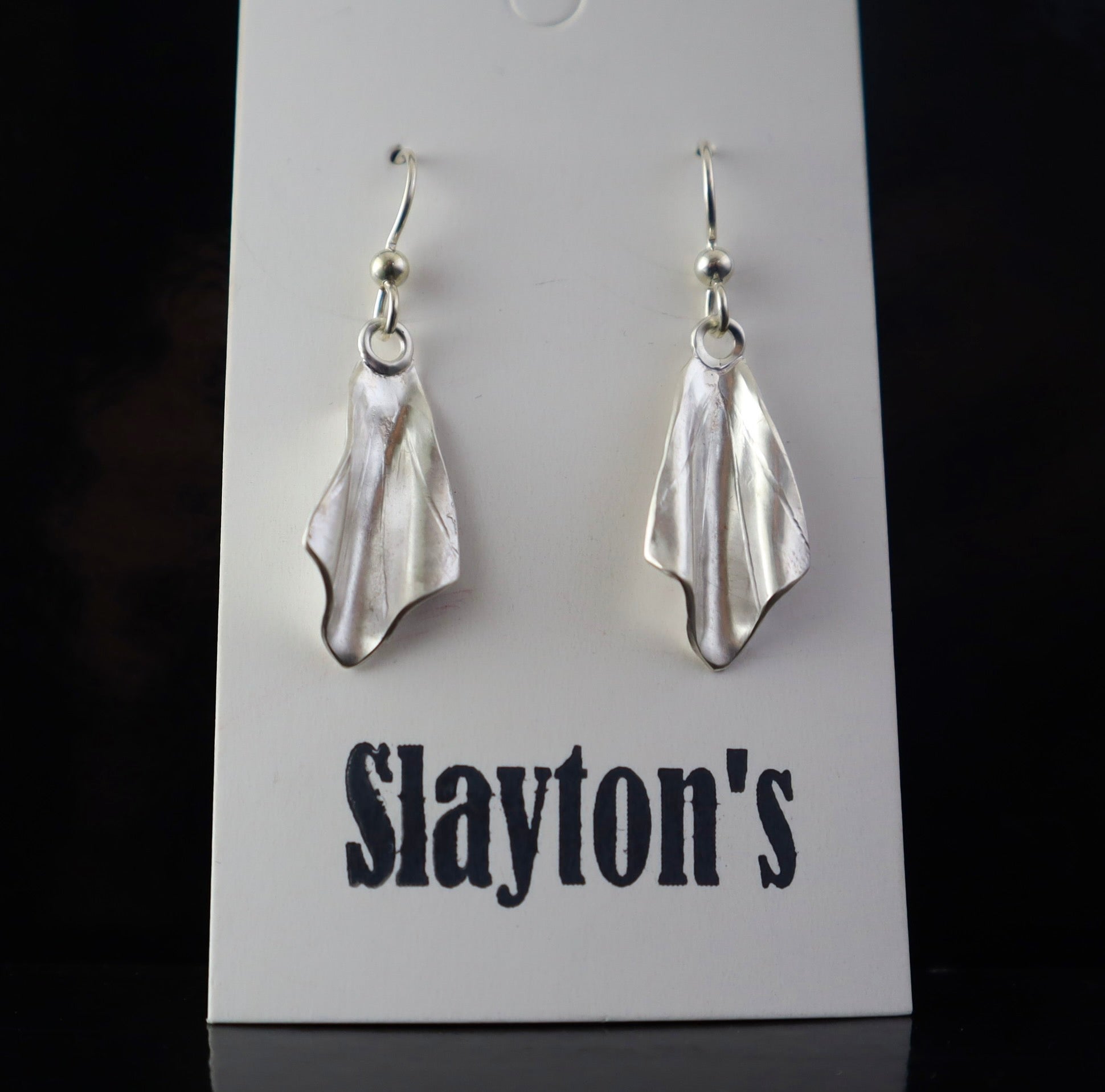 lightweight handmade sterling silver earrings inspired by the shape of butterfly wings